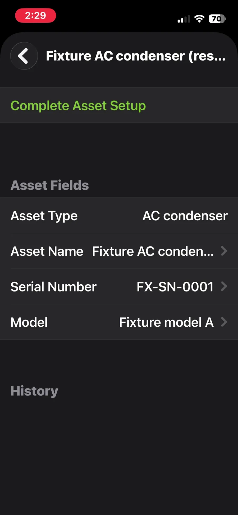 ServiceM8, T-04 (equipment history: see every visit for one rooftop unit): asset on the phone with an empty history. Own capture from the test account, fictional Ridgeline fixture data.